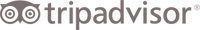 A TripAdvisor logo featuring a circle-eyed owl icon and the text &ldquo;tripadvisor&rdquo; in lowercase, with a black-and-gray color scheme.